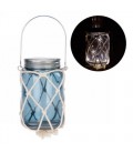 Illuminated blue glass lantern with net